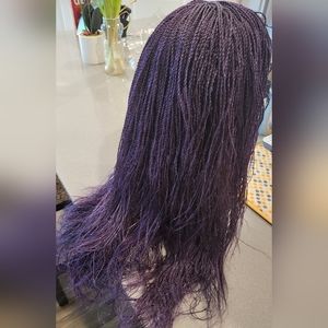 Braided hair wigs bra strap length with clean parting.